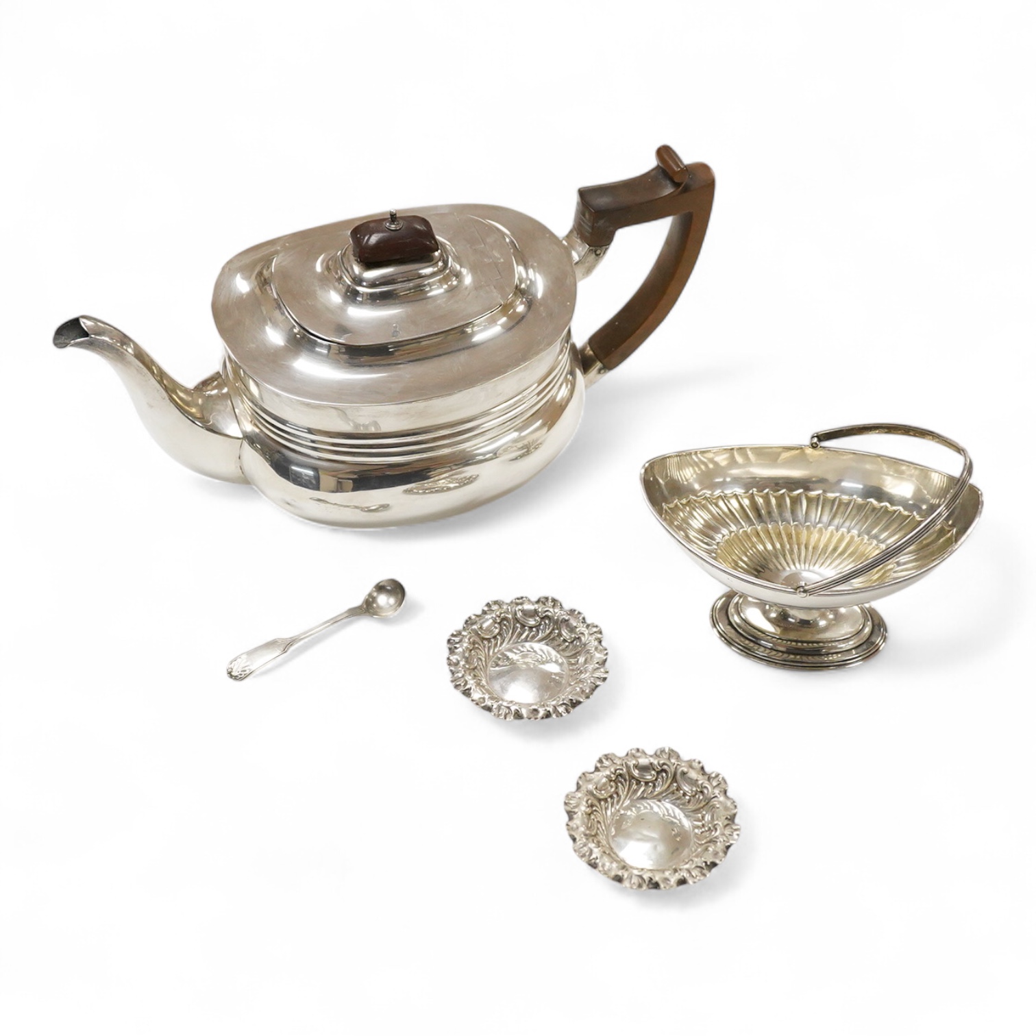 A late Victorian silver boat shaped sugar basket, by Thomas Bradbury & Sons, London, 1896, length 13.2cm, together with a pair of late Victorian repousse silver nut dishes and a silver condiment spoon. 4.8oz.